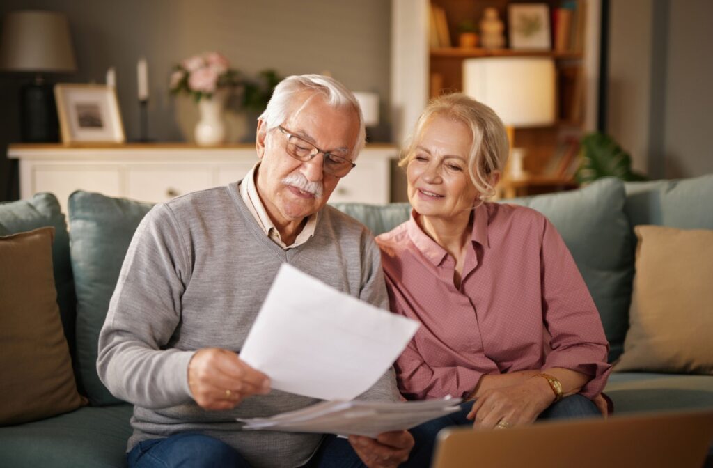 A senior couple looking to move into senior living explore costs of the different levels of care at a senior living community.